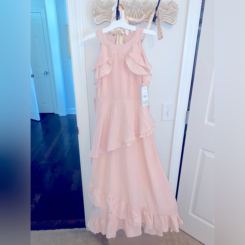 NWT blush colored girls dress size 16. For a wedding, but never worn.